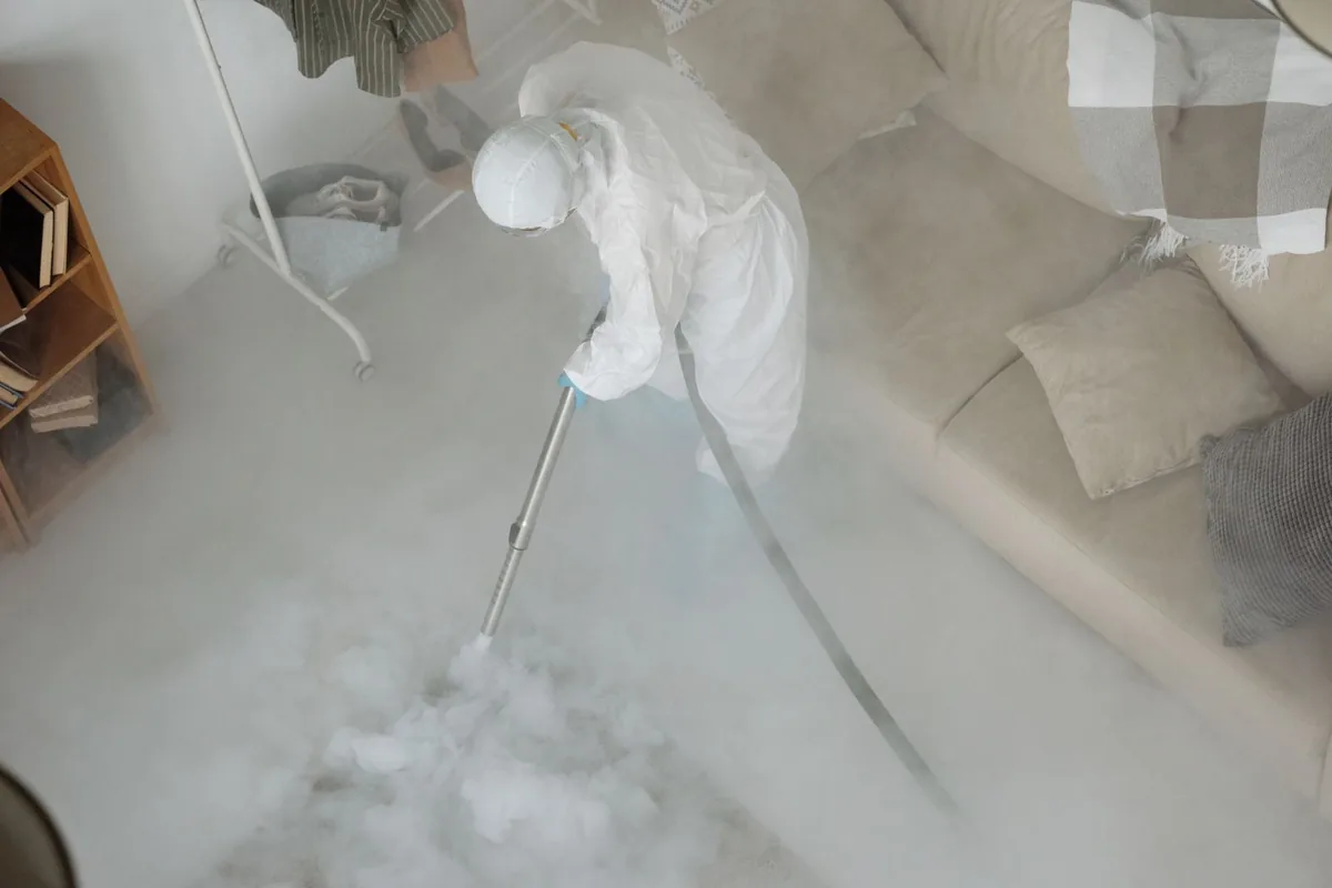Biohazard cleanup technician in protective equipment, Hodgenville, KY